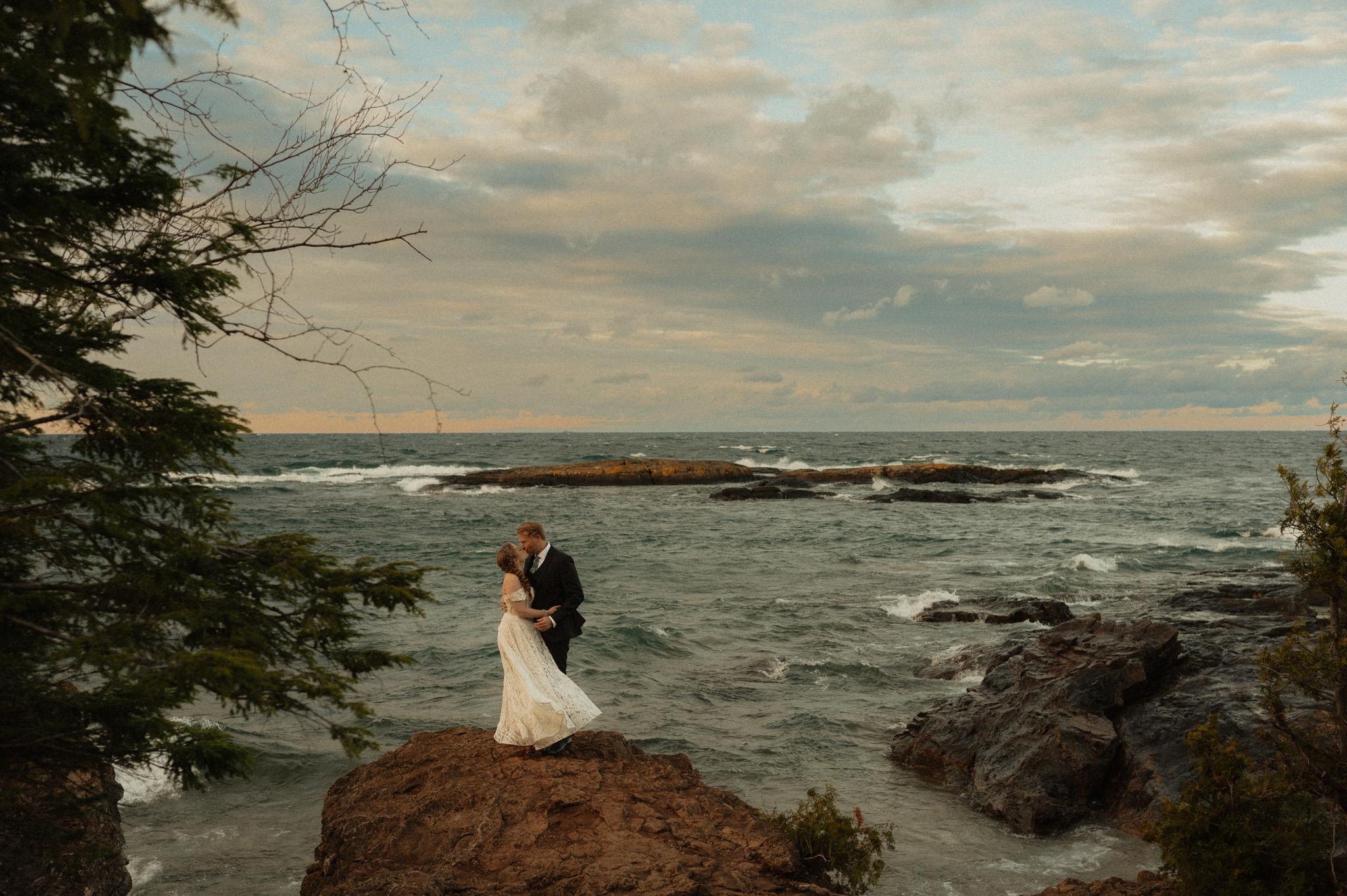 Couple embracing during their adventure session at Black Rocks