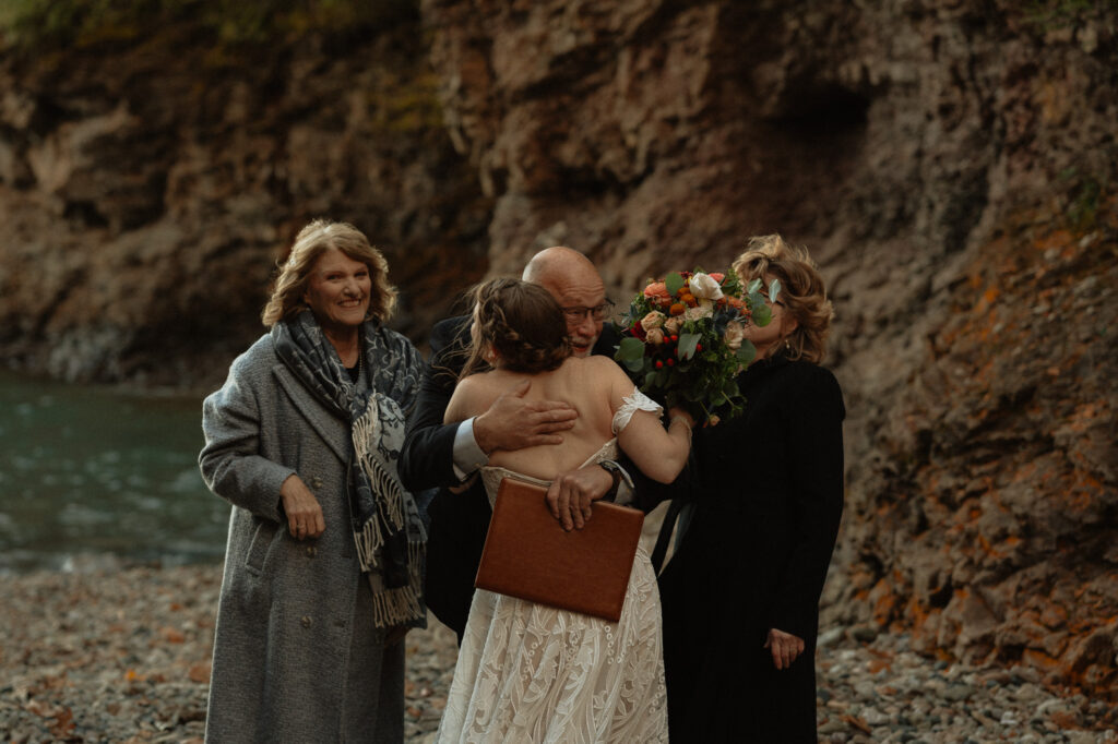 family hugging after wedding in marquette