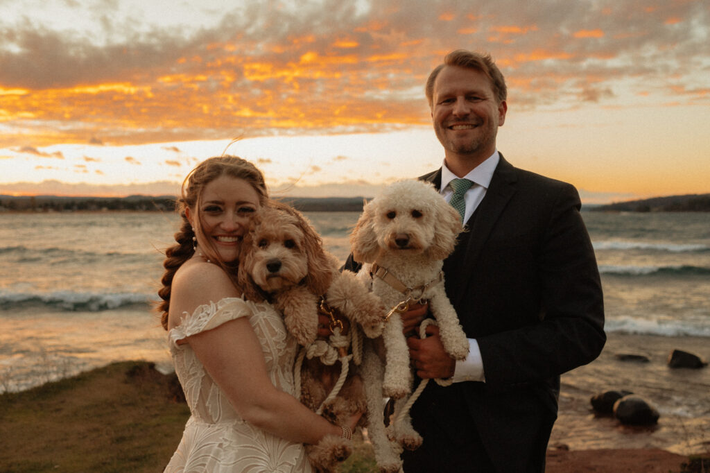 Beautiful sunset portrait of couple with their dogs and family